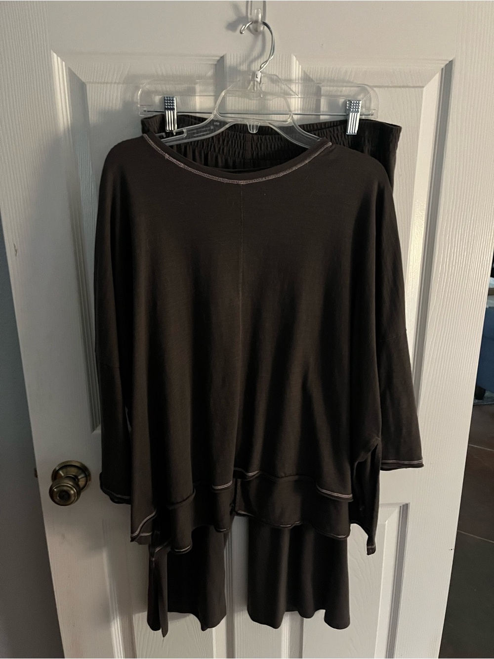 Mersea travel outfit in a soft brown color.